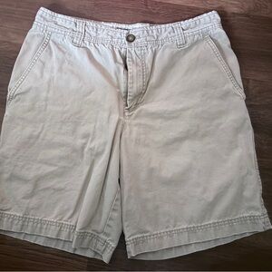 Izod Men's Flat Front Chino Shorts in Light Tan